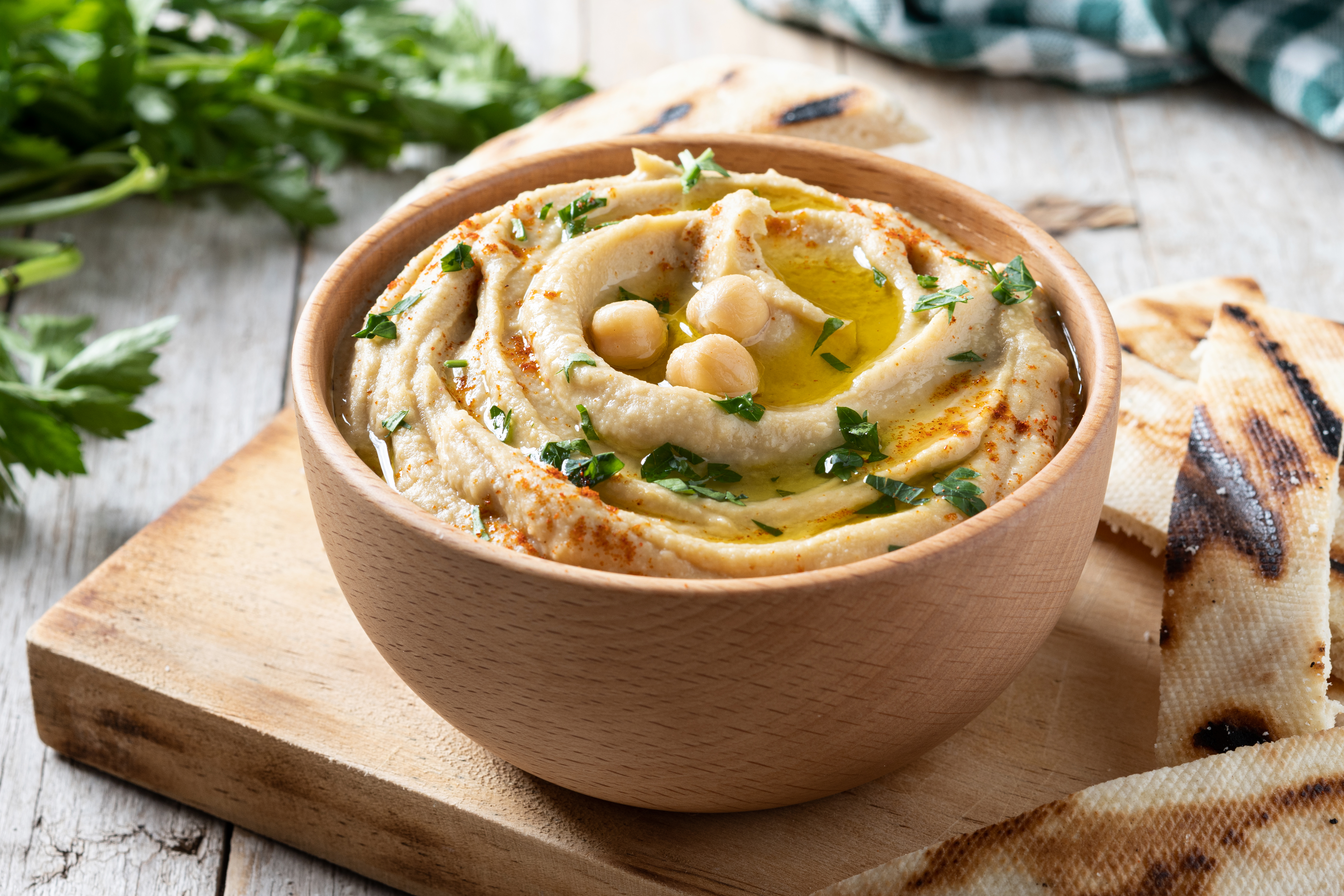 a bowl with delicious hummus and a chickpea-oil topping on it